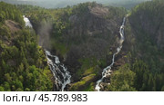 Latefossen is one of the most visited waterfalls in Norway and is located near Skare and Odda in the region Hordaland, Norway. Consists of two separate streams flowing down from the lake Lotevatnet. (2019 год). Стоковое видео, видеограф Андрей Армягов / Фотобанк Лори