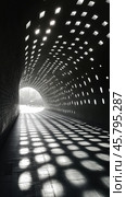 Unique tunnel design with light patterns creating captivating shadows at midday. Стоковое AI-изображение, AI-художник Юлия Гапеенко / Фотобанк Лори