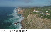 Aerial view of lighthouse at Cape Roca in Portugal (2019 год). Стоковое видео, видеограф Михаил Коханчиков / Фотобанк Лори