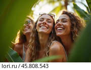 Friends celebrate summer getaway in lush tropical setting with laughter and smiles amidst vibrant greenery. Tropics are climatic zones of Earth in which Sun is at its zenith at least once year. AI. Стоковое AI-изображение, AI-художник Юлия Петровская / Фотобанк Лори