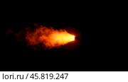 Fiery explosion with orange smoke in dark background flame from barrel rapid combustion intense heat. Стоковое фото, фотограф Павел Муравьев / Фотобанк Лори