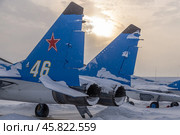 A Soviet multipurpose supersonic fighter. A blue fighter jet in winter at the airfield. The supersonic aircraft is designed to engage and destroy air targets and ground targets. Стоковое фото, фотограф Эдуард Белкин / Фотобанк Лори