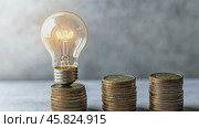 Counting and Calculate Cost Money of Electricity and Heating Bill. Electric Glowing Light Bulb and Stack of Coins on a Light Background. Increase in the Cost of Electricity. Price Hike. Energy Crisis. Стоковое AI-видео, аниматор Марина Демидюк / Фотобанк Лори