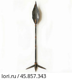 Medieval arrow standing on white background with metal tip and fletching. Стоковое AI-изображение, AI-художник Иван Рябоконь / Фотобанк Лори