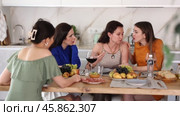 At cozy home gathering, attentive female friends comforting and supporting upset woman, discussing problems and giving advice over glass of wine. Стоковое видео, видеограф Яков Филимонов / Фотобанк Лори