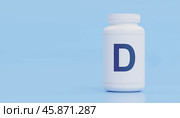 Vitamin D supplement bottle, blue background, essential nutrient, bones, immunity boost, overall wellness, health importance, strong bones, improved immune system. Стоковое фото, фотограф Павел Муравьев / Фотобанк Лори