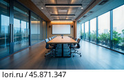 Sleek conference room featuring wooden table, leather chairs, bright natural light, large display screen, indoor plants, glass walls, professional business environment design. Стоковое фото, фотограф Павел Муравьев / Фотобанк Лори