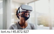 Happy smiling man Afro American black in futuristic style virtual reality headset in a bright room, in white clothes. In low poly style, showing intelligent AI model with accurate wireframe design. Стоковое AI-видео, аниматор ALLA YURTAYEVA / Фотобанк Лори