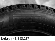 Brand new tire by Pirelli. Close up photo. Редакционное фото, фотограф EugeneSergeev / Фотобанк Лори