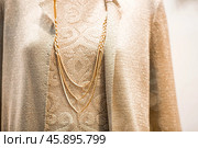An elegant showcase of an expensive luxury store with stylish mannequins in clothes and evening lighting. The concept of shopping and sales. Стоковое фото, фотограф Photojuli / Фотобанк Лори