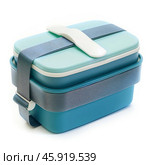 Turquoise and light green lunch box with elastic band closure. Стоковое AI-изображение, AI-художник Иван Рябоконь / Фотобанк Лори
