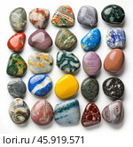 Colorful polished gemstones forming a square on white background. Стоковое AI-изображение, AI-художник Иван Рябоконь / Фотобанк Лори