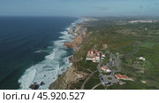 Aerial view of lighthouse at Cape Roca in Portugal (2019 год). Стоковое видео, видеограф Михаил Коханчиков / Фотобанк Лори