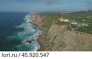 Aerial view of lighthouse at Cape Roca in Portugal (2019 год). Стоковое видео, видеограф Михаил Коханчиков / Фотобанк Лори