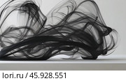 Black ink flowing and mixing on white background. Стоковое AI-видео, аниматор Юрий Поздников / Фотобанк Лори