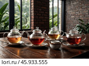 Collection of variety ceylon teas on wooden table in meeting room at manufacturing plant on tea factory, still life. Demonstration perfect tea set, close-up. Tea production concept. Copy ad text space. Стоковое AI-изображение, AI-художник Aleksandr Golubev / Фотобанк Лори