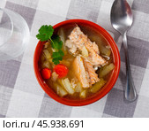 Salmon offal soup with vegetables - potatoes, carrots and parsley. Стоковое фото, фотограф Яков Филимонов / Фотобанк Лори