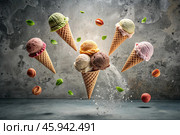 Sweet dessert. Ice cream cones with different flavors on a concrete gray background. World Ice Cream Day. Стоковое AI-изображение, AI-художник Photojuli / Фотобанк Лори