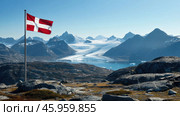 The Danish flag flies against a majestic arctic landscape of snow-capped mountains, glaciers and a cold blue fjord. Стоковое AI-изображение, AI-художник Александр Довянский / Фотобанк Лори