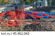 The construction site has plastic pipes for laying communications and water supply. Polymer pipes for laying in trenches during construction and repair. Стоковое фото, фотограф Эдуард Белкин / Фотобанк Лори