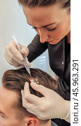Doctor performing hair loss treatment injecting serum into patient's scalp. Стоковое AI-изображение, AI-художник Юрий Поздников / Фотобанк Лори