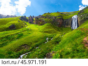 Picturesque landscape with beautiful Terskol waterfall and green slopes. Caucasus, Elbrus region. Стоковое фото, фотограф Константин Лабунский / Фотобанк Лори