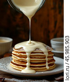 Pancakes with condensed milk. Pancake week. Maslenitsa is an Eastern Slavic traditional holiday celebrated a week before Lent. Стоковое AI-изображение, AI-художник Сергей Елизарьев / Фотобанк Лори
