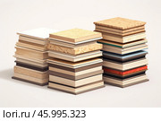 Stacks of different construction materials showing wood composites and laminates. Стоковое AI-изображение, AI-художник Иван Рябоконь / Фотобанк Лори