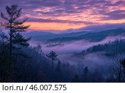 Purple and orange sunrise illuminating foggy appalachian mountains. Стоковое AI-изображение, AI-художник Иван Рябоконь / Фотобанк Лори