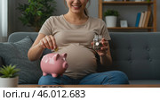 Pregnant woman saving money, Saving for baby, Pregnancy financial planning, Expecting mother savings, Saving with piggy bank, Baby expenses, Future family finances, Financial security for baby, Motherhood saving, Prenatal planning, Maternity saving, Saving for newborn, preparing for parenthood, woman saving coins, baby on the way, planning for childcare, budget for pregnancy, пособие на ребенка, соцзащита населения в действии. Стоковое AI-изображение, AI-художник Сергей Расторгуев / Фотобанк Лори