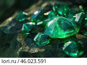 Raw emeralds showing inclusions resting on dark rock. Стоковое AI-изображение, AI-художник Иван Рябоконь / Фотобанк Лори
