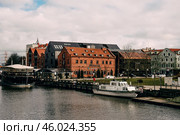 Klaipeda, Lithuania, February 2019, City street cloudy rainy day, little town. Редакционное фото, фотограф Spirit River / Фотобанк Лори