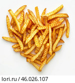 Delicious crinkle cut french fries forming a heart shape. Стоковое AI-изображение, AI-художник Иван Рябоконь / Фотобанк Лори