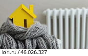 House model in a Scarf. Creativity Image of Cold Season. Heating System, Winter is Coming Creative Concept. Mini residential house Wearing a Knitted Warm Clothes. Electricity and Gas Price Rising. Стоковое AI-видео, аниматор Марина Демидюк / Фотобанк Лори