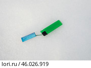 Петарда и зажигалка на снегу. Стоковое фото, фотограф Краснова Ирина / Фотобанк Лори