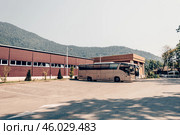 Large passenger buses stand in parking lot of bus station. Стоковое фото, фотограф Spirit River / Фотобанк Лори
