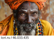 Indian sadhu wearing orange turban and colorful necklace looking at camera. Стоковое AI-изображение, AI-художник Иван Рябоконь / Фотобанк Лори