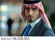 Lifestyle portrait of confident arab businessman wearing traditional keffiyeh and suit. Стоковое AI-изображение, AI-художник Иван Рябоконь / Фотобанк Лори