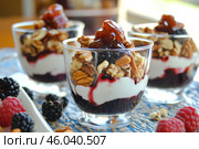 Fresh Berry Trifle in Glasses. Dessert with Raspberries and Whipped Cream. Layered Yogurt with Berry Fruits. Berry Pudding Glass Jars. Food Marketing, Recipe Design. Colorful Sweet Treat. Fruity Quark. Стоковое AI-изображение, AI-художник Марина Демидюк / Фотобанк Лори