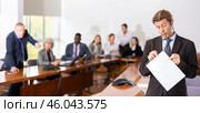 Sad middle aged white brunette businessman being reprimanded and fired. Стоковое фото, фотограф Яков Филимонов / Фотобанк Лори