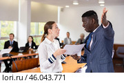 Middle aged african male boss dismissing young white female employee. Стоковое фото, фотограф Яков Филимонов / Фотобанк Лори