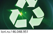 Green earth cover with Recycle symbol on green grass field on natural background. Waste and pollution elimination, clean and renewable energy concept, green world, eco friendly, environment day. Ecological problem, Green energy icon, background. Стоковое AI-видео, аниматор ALLA YURTAYEVA / Фотобанк Лори