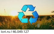 Green earth cover with Recycle symbol on green grass field on natural background. Waste and pollution elimination, clean and renewable energy concept, green world, eco friendly, environment day. Ecological problem, Green energy icon, background. Стоковое AI-видео, аниматор ALLA YURTAYEVA / Фотобанк Лори