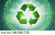 Green earth cover with Recycle symbol on green grass field on natural background. Waste and pollution elimination, clean and renewable energy concept, green world, eco friendly, environment day. Ecological problem, Green energy icon, background. Стоковое AI-видео, аниматор ALLA YURTAYEVA / Фотобанк Лори