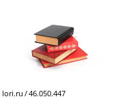 Red and black books isolated on a white background. Стоковое фото, фотограф Елена  Попкова / Фотобанк Лори