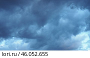 Heavy clouds fill the sky, signaling an impending storm. The atmospheric change creates a dramatic backdrop as daylight wanes, hinting at rain on the horizon. Стоковое видео, видеограф Юлия Петровская / Фотобанк Лори