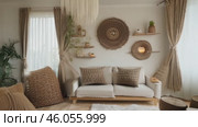Scandinavian style apartment interior with sea view. Living room design with natural wood decor elements in boho style. Video 4k. Стоковое видео, видеограф ALLA YURTAYEVA / Фотобанк Лори