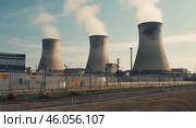 Steaming Cooling towers of nuclear power plant. Стоковое AI-изображение, AI-художник Ирина Старикова / Фотобанк Лори