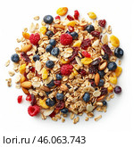 Rolled oats, dry fruits, nuts and berries creating appealing breakfast muesli mix. Стоковое AI-изображение, AI-художник Иван Рябоконь / Фотобанк Лори