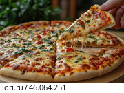 Freshly made pizza with melted cheese that stretches deliciously when you lift a slice. The dough is soft, with a lightly browned crust. The toppings include tomato sauce, mozzarella cheese, fresh cherry tomatoes and herbs that add flavor. The pizza is served on a wooden board, and in the background you can see the greenery, creating a cozy atmosphere of Italian cuisine. Стоковое AI-изображение, AI-художник Анна Кривицкая / Фотобанк Лори